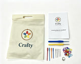 Crochet hooks, yarn needles, and stitch markers from Crafty kit