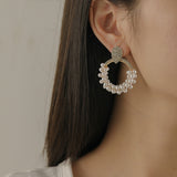 Winding Pearl Hollowed Circle Earrings